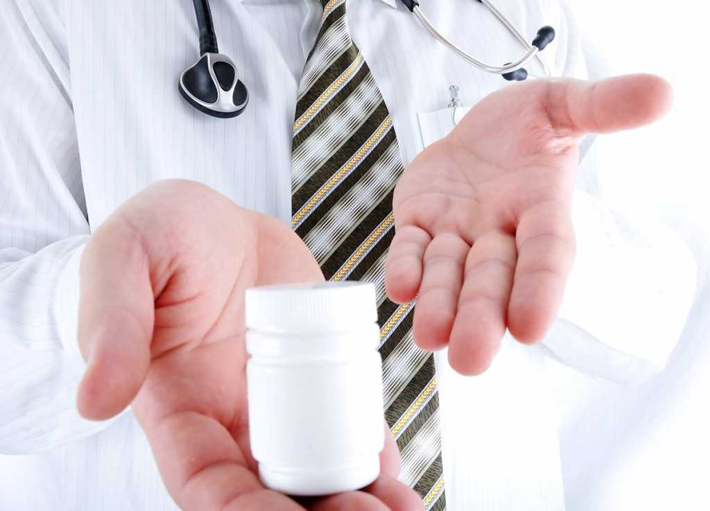 closeup-doctor-holding-little-pills-bottle-copy-space-for-you_sy3mq4ceo